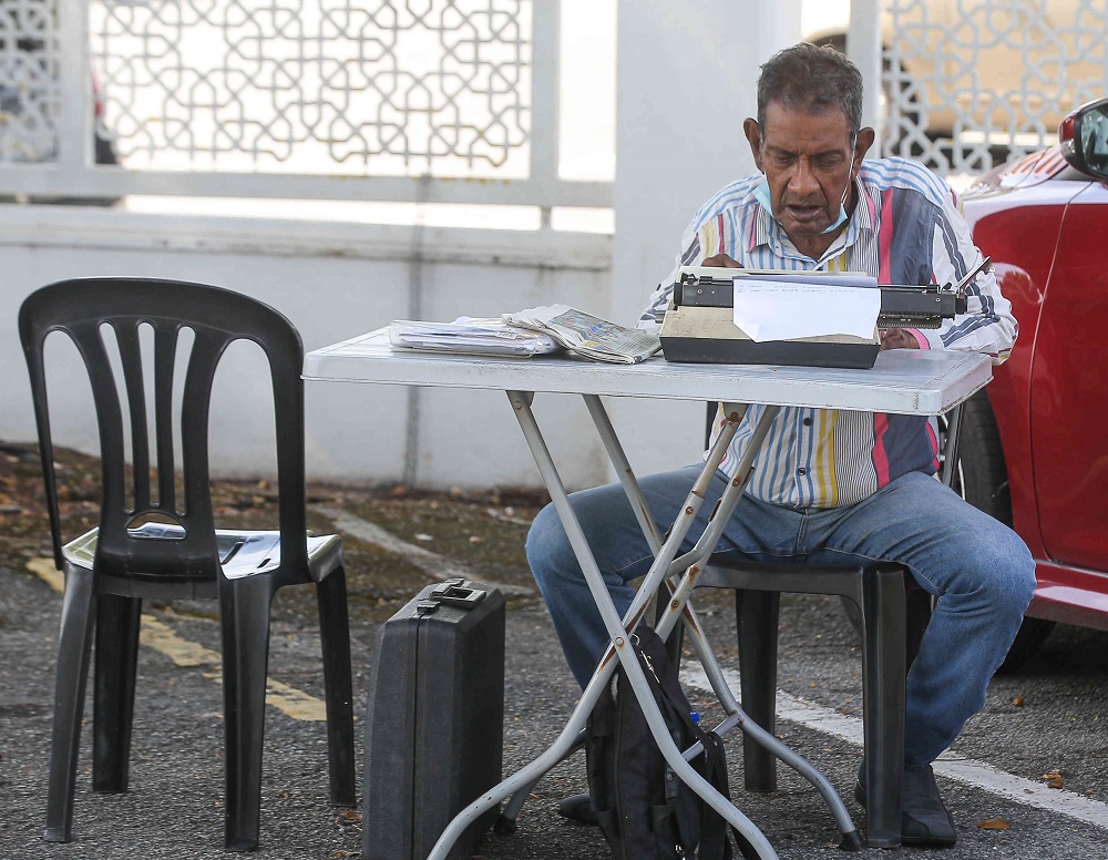 Septogenarian Ezekiel Velu is one of the surviving petition writers in Ipoh who steadfastly ensures the trade continues. u00e2u20acu201d Picture by Farhan Najib