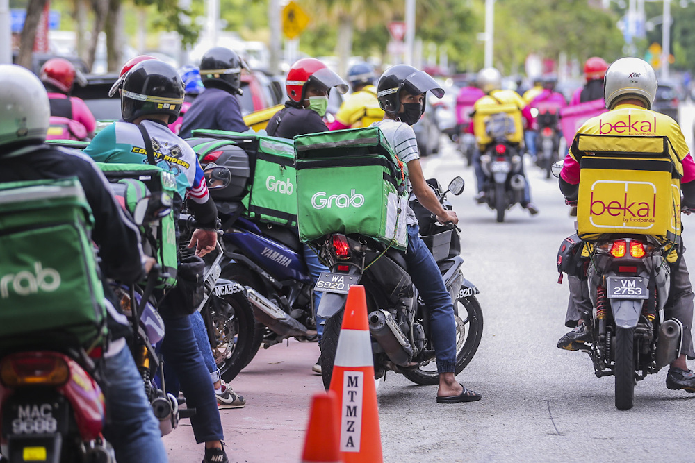 File picture of food delivery riders at Tuanku Mizan Zainal Abidin Mosque April 17, 2021. ― Picture by Hari Anggara