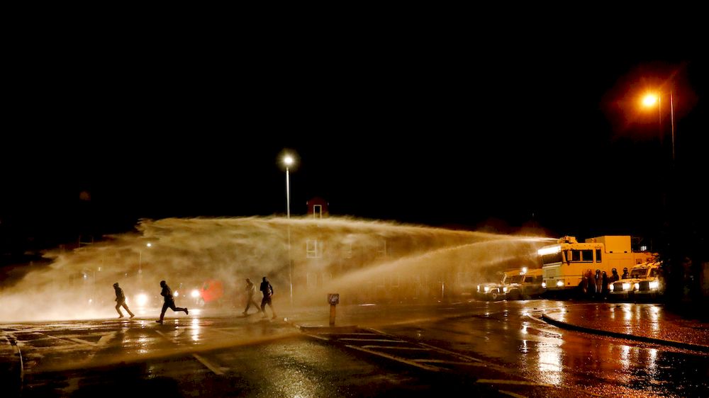 Rioters react as the police uses a water cannon on the Springfield Road as protests continue in Belfast, Northern Ireland April 8, 2021. u00e2u20acu201d Reuters pic