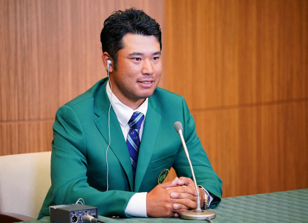 Winner of the 85th golf Masters Hideki Matsuyama of Japan, wearing the green jacket, attends an online press conference in Tokyo April 14, 2021. u00e2u20acu201d STR/Jiji Press handout pic via AFPnn