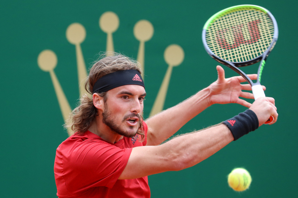 Greeceu00e2u20acu2122s Stefanos Tsitsipas plays a return during his quarter final singles match against Spainu00e2u20acu2122s Alejandro Davidovich Fokina on day seven of the Monte-Carlo ATP Masters Series tournament in Monaco April 16, 2021. u00e2u20acu201d AFP picnn