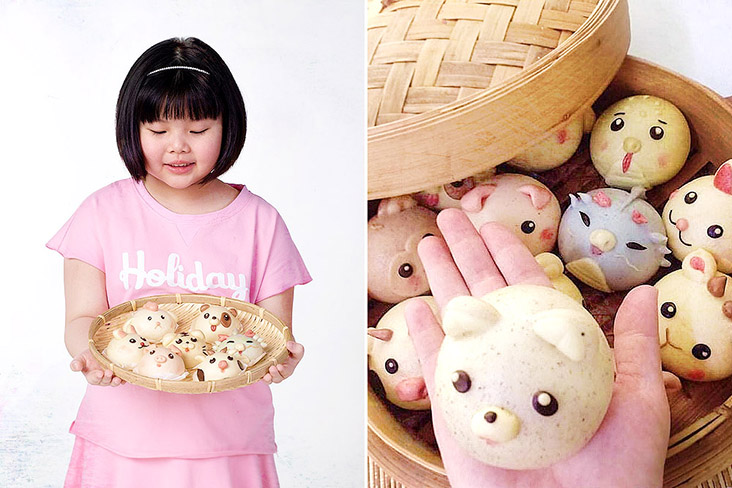 Little Zoey showing off freshly steamed Cartoon Buns shaped like cute animal characters.