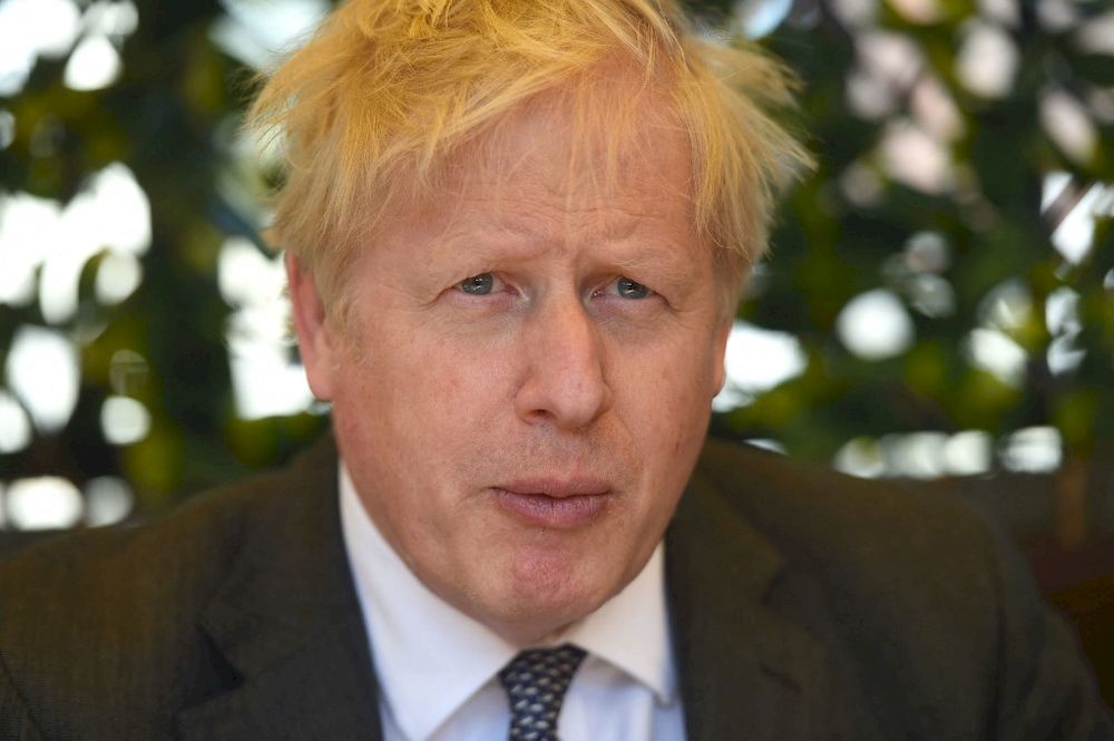 Britainu00e2u20acu2122s Prime Minister and leader of the Conservative Party, Boris Johnson reacts during a visit to The Mount Tavern pub and restaurant in Wolverhampton, England, on April 19, 2021, while campaigning for the upcoming local elections. u00e2u20acu201d AFP pic