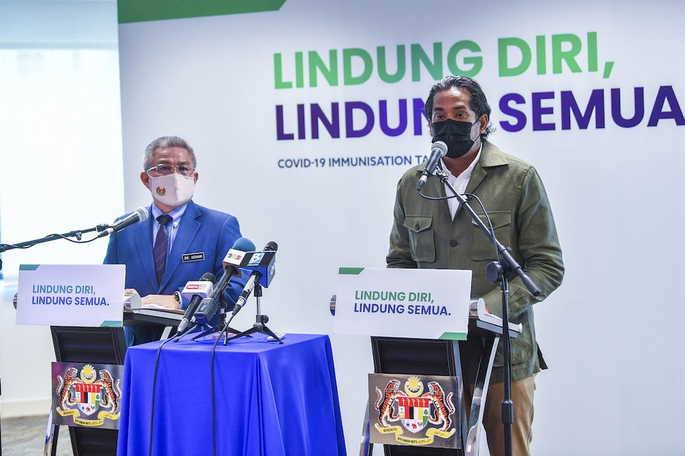 Coordinating Minister for National Covid-19 Immunisation Programme Khairy Jamaluddin (right) at a press conference in Putrajaya, April 12, 2021 with Health Minister Datuk Seri Dr Adham Baba on the latest development of the National Covid-19 immunisation P