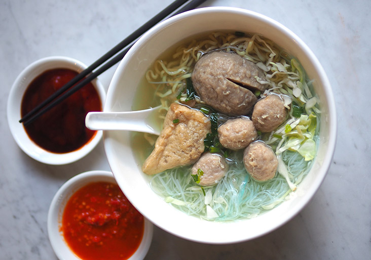 The 'bakso' is served with two types of noodles, bouncy meatballs and a stuffed beancurd puff