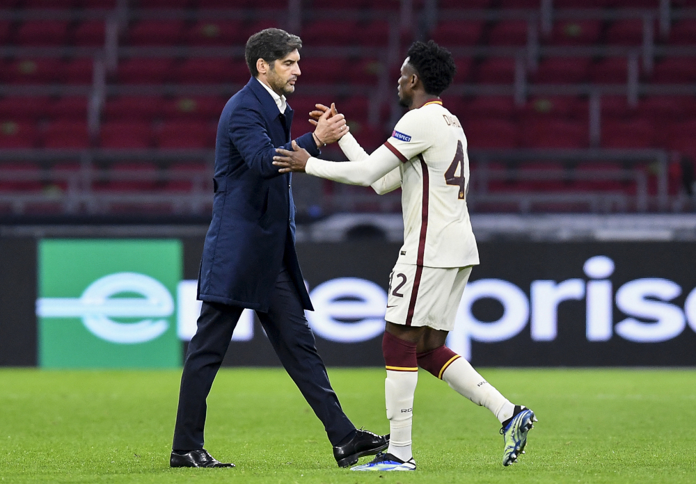 Roma coach Paulo Fonseca shakes hands with Roma midfielder Amadou Diawara at the end of the Uefa Europa League quarter-final football match between Ajax Amsterdam and AS Roma at the Johan Cruijff Arena in Amsterdam April 8, 2021. u00e2u20acu201d AFP picnn