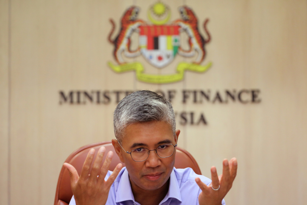 Finance Minister Datuk Seri Tengku Zafrul speaks during an interview with Reuters in Putrajaya, April 5, 2021. — Reuters pic