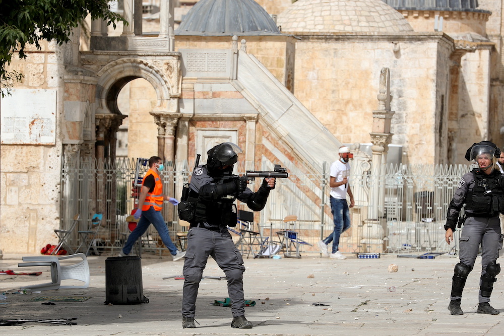 A member of Israeli police aims a weapon during clashes with Palestinians at the compound that houses Al-Aqsa Mosque, known to Muslims as Noble Sanctuary and to Jews as Temple Mount, in Jerusalem's Old City May 10, 2021. u00e2u20acu201d Reuters pic