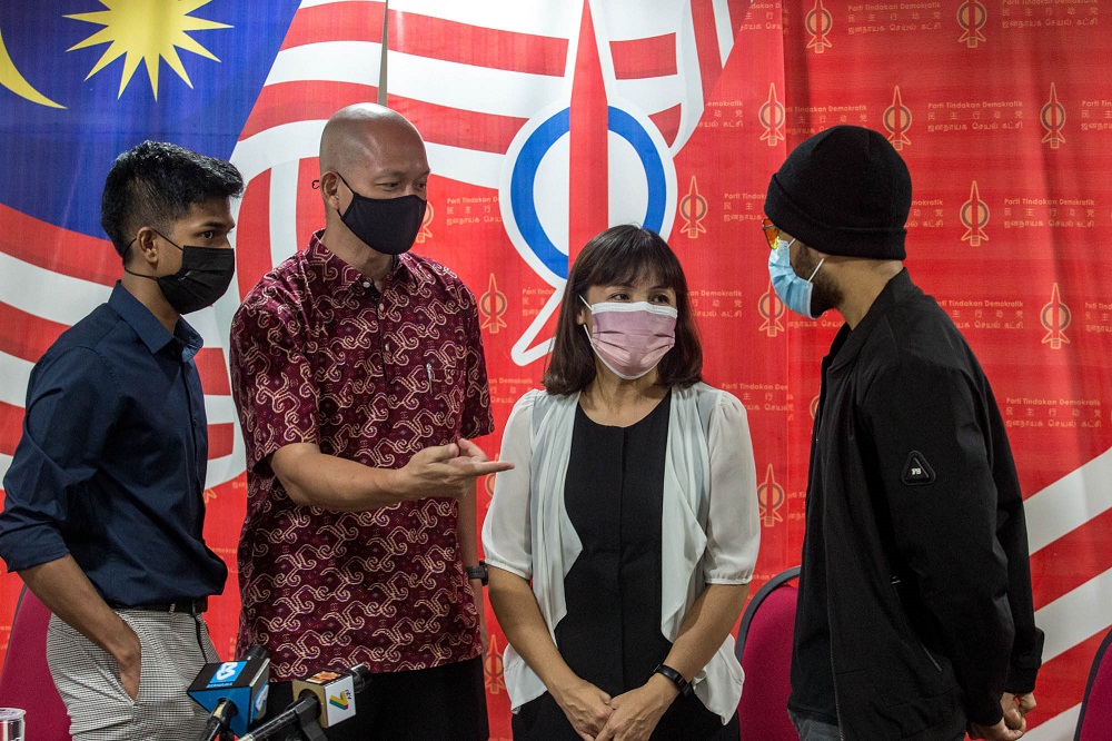Kulai MP Teo Nie Ching (second right) speaks to a LimKokWing University student after a press conference in Kuala Lumpur May 3, 2021. — Picture by Firdaus Latif