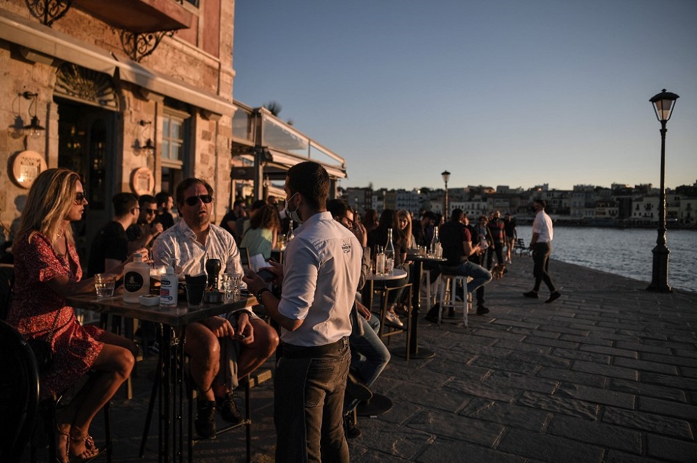 People enjoy an outside terrace in the old town of Chania (La Canee) on the island of Crete May 14, 2021. u00e2u20acu201d AFP pic