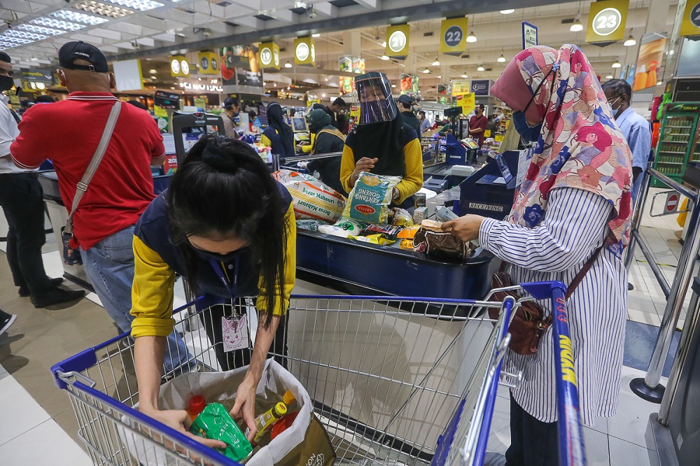 People queue up at the check-out counter at Mydin Mall USJ 1 in Subang Jaya May 29, 2021. u00e2u20acu201d Picture by Yusof Mat Isa