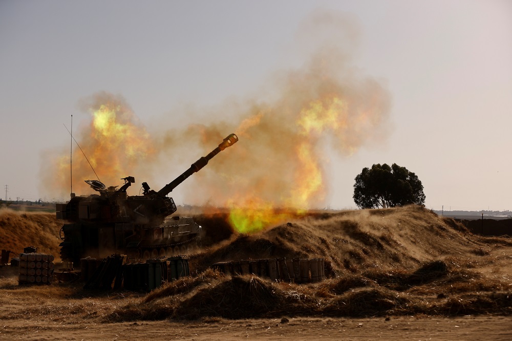 An Israeli mobile artillery unit fires near the border between Israel and the Gaza Strip, May 12, 2021. u00e2u20acu2022 Reuters pic