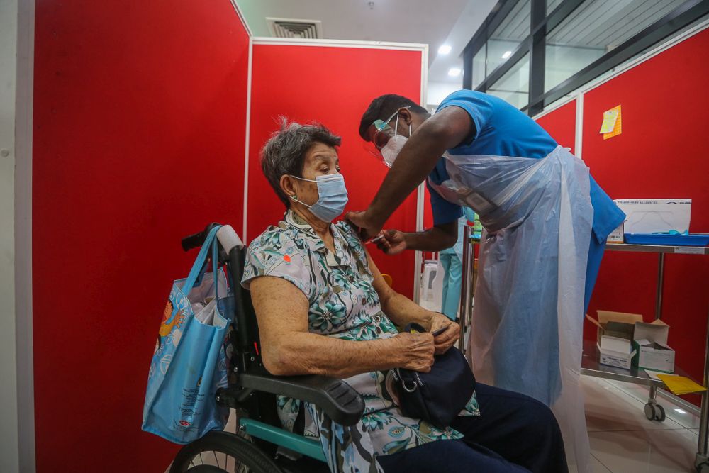 A senior citizen receives the Sinovac Covid-19 vaccine at the MSU Medical Centre in Shah Alam May 25, 2021. — Picture by Yusof Mat Isa