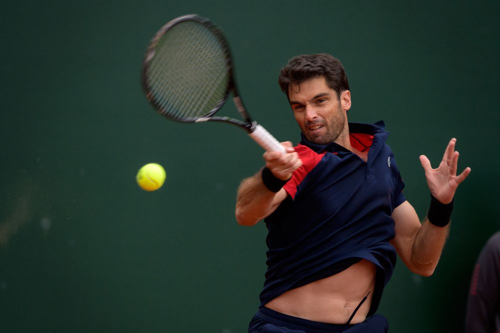 Spain's Pablo Andujar returns the ball during his ATP 250 Geneva Open tennis match against against Switzerland's Roger Federer in Geneva on May 18, 2021. u00e2u20acu201d AFP pic