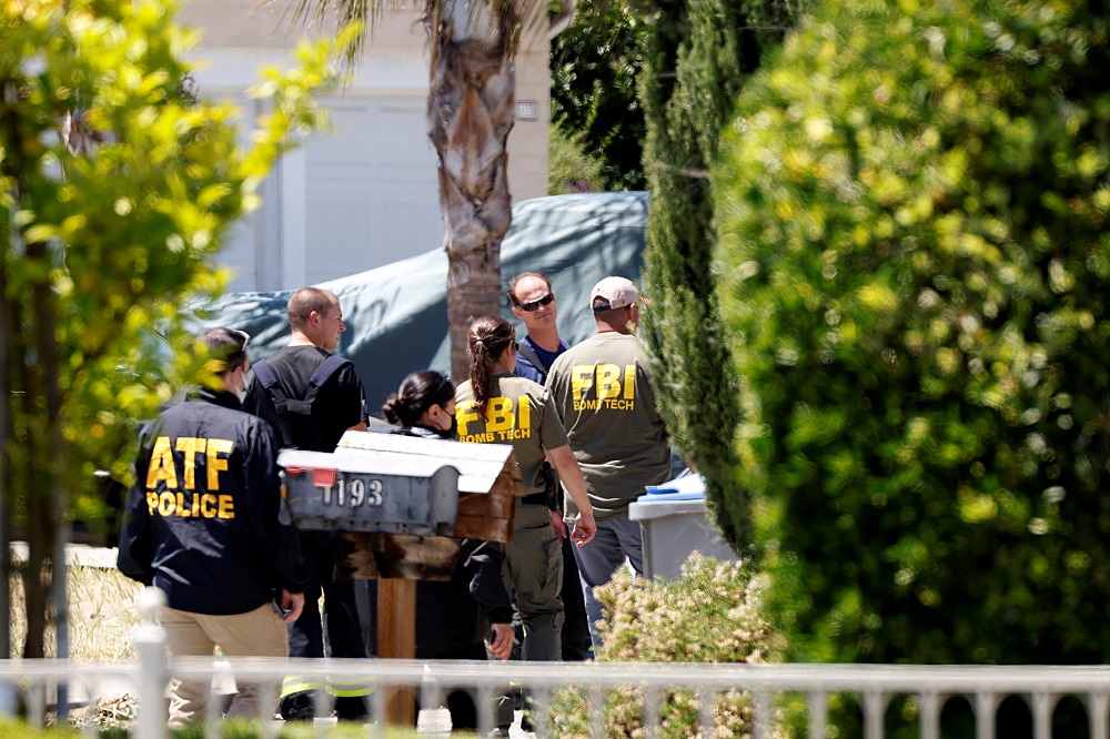 Investigators seek motive in California railyard rampage that killed nine
