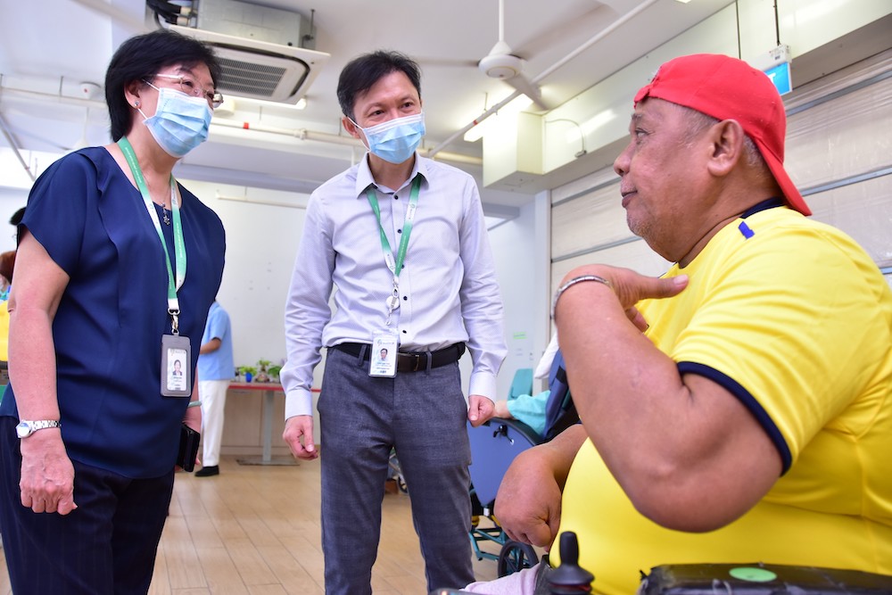 en Ci chief nurse Jenny Sim Teck Meh (left), 70, checking in on a nursing home resident who received his vaccination on Jan 20, 2021. ― Photo courtesy of Ren Ci 