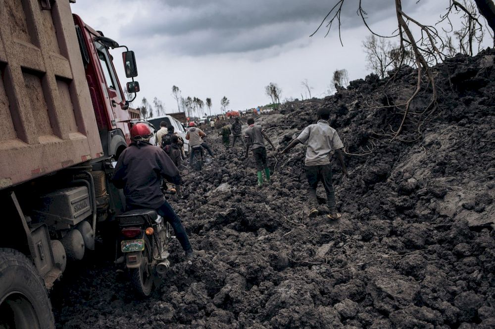 Motorbike drivers and trucks drive through the solidified lava flow of Nyiragongo volcano in the northern neighbourhoods of Goma, the provincial capital of North Kivu, on May 28, 2021. u00e2u20acu201d AFP pic