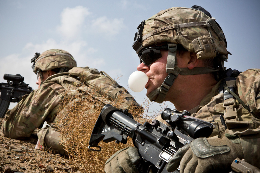 A US Army soldier with Charlie Company, 36th Infantry Regiment, 1st Armored Division blows a bubble with his chewing gum during a mission near Command Outpost Pau00e2u20acu2122in Kalay in Maiwand District, Kandahar February 3, 2013. u00e2u20acu201d Reuters pic