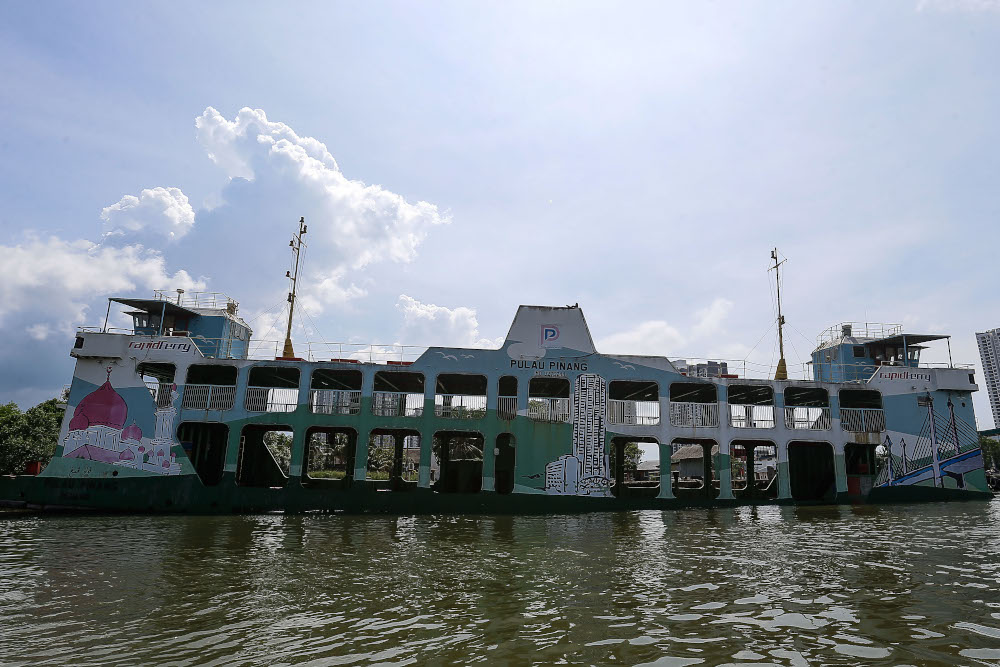 A Penang ferry is seen partly submerged near the Bagan Dalam Drydock on June 6, 2021. — Picture by Sayuti Zainudin