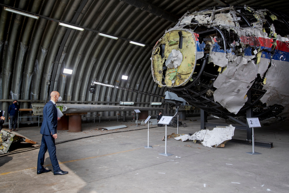 Presiding judge Hendrik Steenhuis views the reconstructed wreckage of Malaysia Airlines Flight MH17, at the Gilze-Rijen military airbase, southern Netherlands May 26, 2021. u00e2u20acu201d AFP pic 
