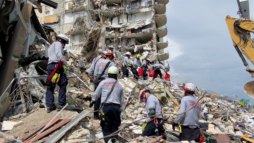 Rescue crew respond at the site after a partial building collapse in Surfside near Miami Beach, Florida, US, June 25, 2021, in this still image obtained from video. Courtesy of Miami-Dade Fire Rescue / Florida Task Force One. u00e2u20acu201d Reuters picnnn