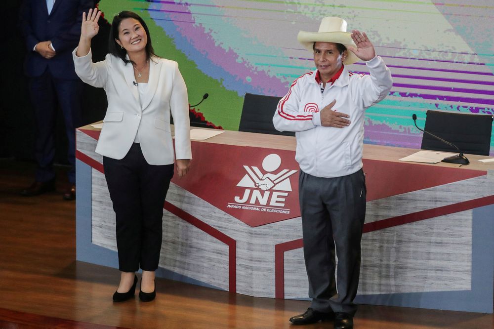 Peruu00e2u20acu2122s right-wing candidate Keiko Fujimori and socialist candidate Pedro Castillo wave at the end of their debate ahead of the June 6 run-off election, in Arequipa, Peru, May 30, 2021. u00e2u20acu201d Reuters pic