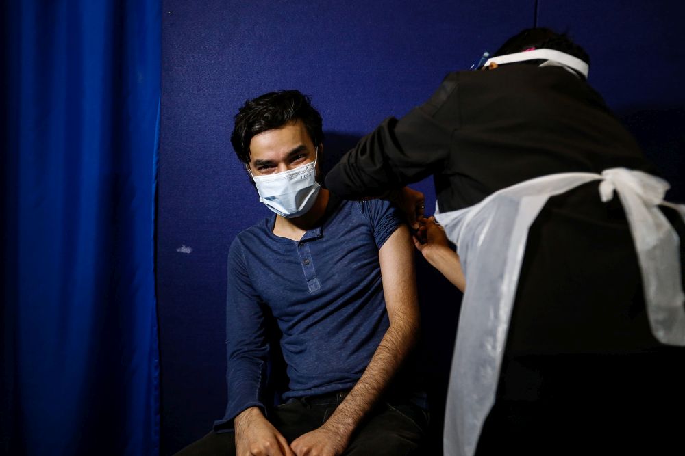 A nurse administers a dose of the Covid-19 vaccine at the Pikas vaccination centre at the Bukit Jawi Golf Resort in Penang June 17, 2021. — Picture by Sayuti Zainudin