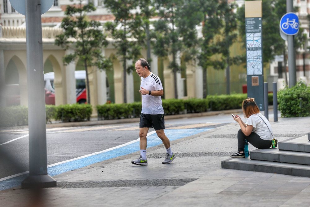 A man jogs during the movement control order in Kuala Lumpur city centre June 2, 2021. u00e2u20acu201d Picture by Ahmad Zamzahuri