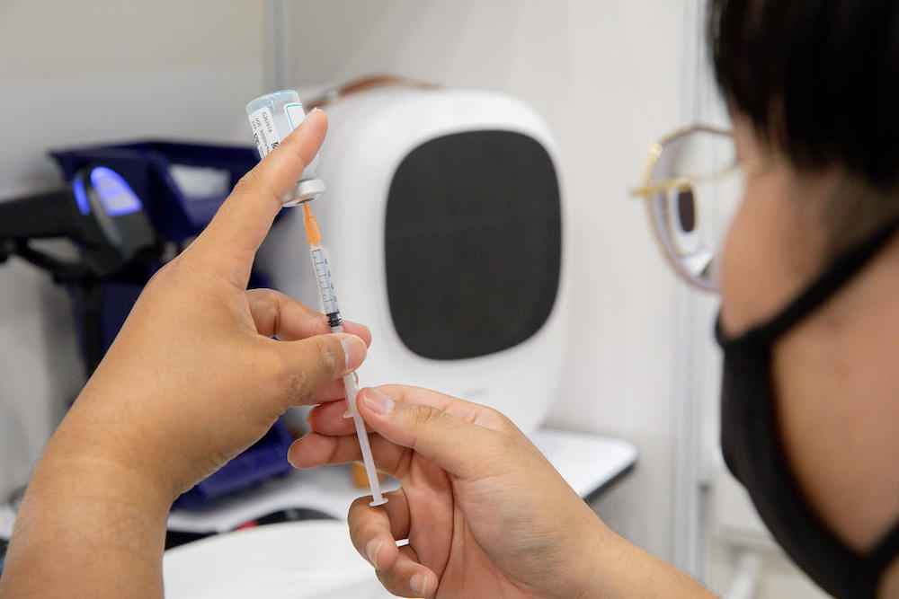 A nurse draws the Moderna Covid-19 vaccine from a vial at a vaccination centre in Yew Tee Community Centre on April 21, 2021. u00e2u20acu201d TODAY pic