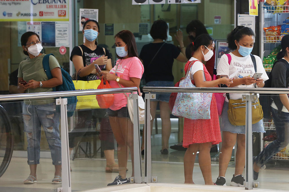 Domestic helpers at Lucky Plaza on their day off in Singapore May 2, 2021. u00e2u20acu201d Picture by Ooi Boon Keong/TODAY