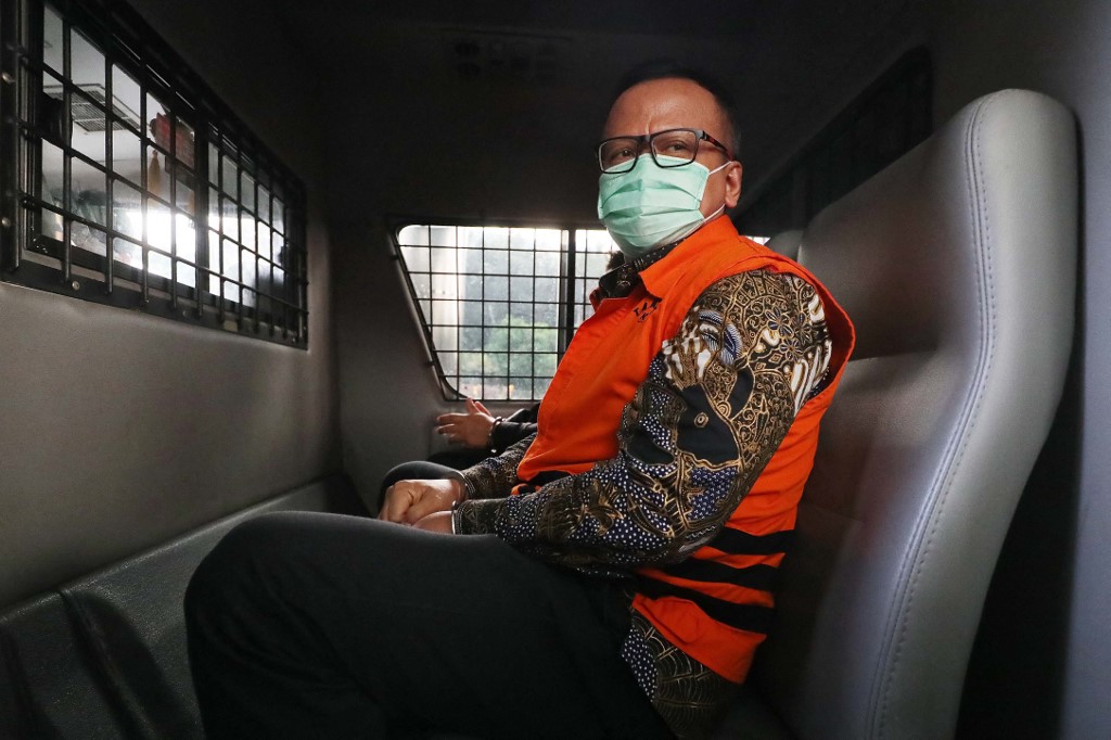 Indonesiau00e2u20acu2122s former fisheries minister Edhy Prabowo sits in a detention vehicle following a verdict hearing in Jakarta on July 15, 2021, after being sentenced to five years in prison in a corruption case linked to baby lobster exports. u00e2u20acu201d AFP pic