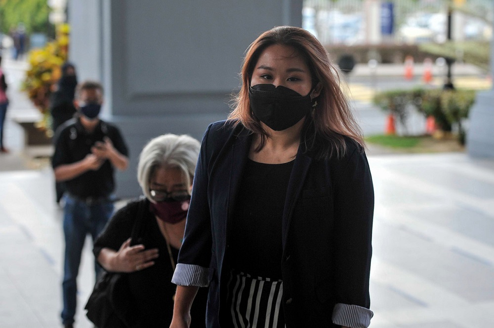 Refuge for the Refugees founder Heidy Quah (right) arrives at the Sessions Court in Kuala Lumpur July 27, 2021. — Bernama pic