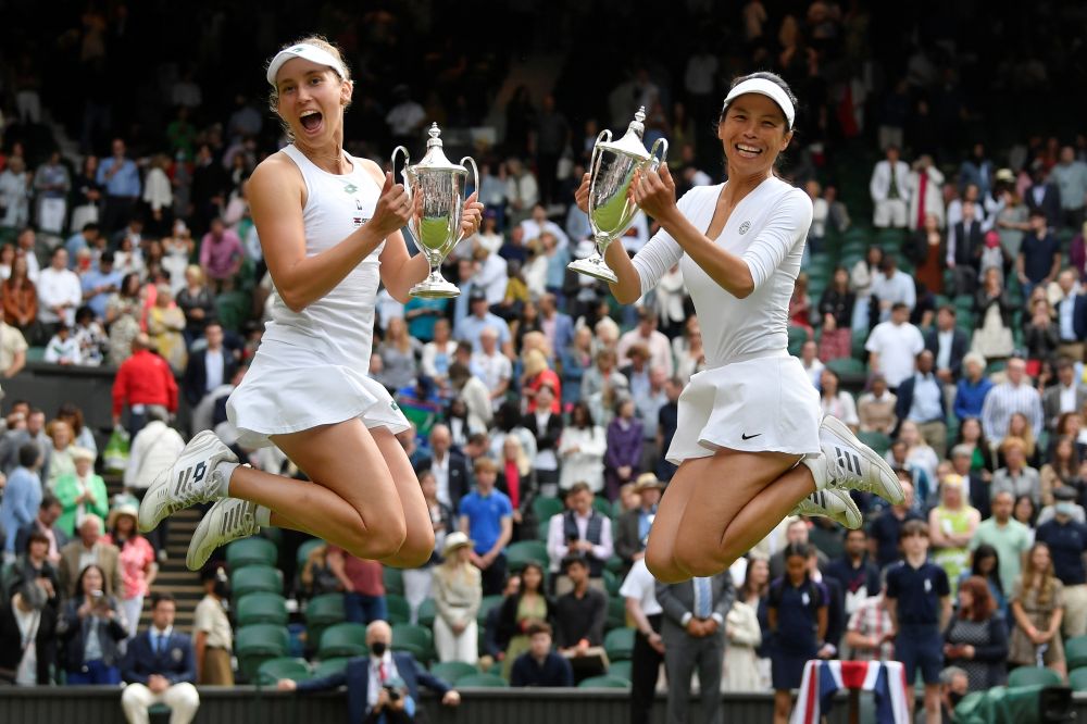 Taiwan's Hsieh Su-wei and Belgium's Elise Mertens celebrate with the trophies after winning the women's doubles final against Elena Vesnina and Veronika Kudermetova at the All England Lawn Tennis and Croquet Club, London July 10, 2021. u00e2u20acu201d Reuters pic
