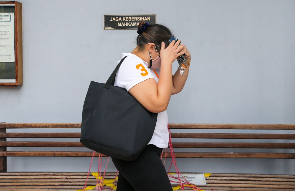 Team Force Scaffolding and Insulation Sdn Bhd director Lau Kiew Ling arrives at the Ipoh Sessions Court July 27, 2021. u00e2u20acu201d picture by Farhan Najib