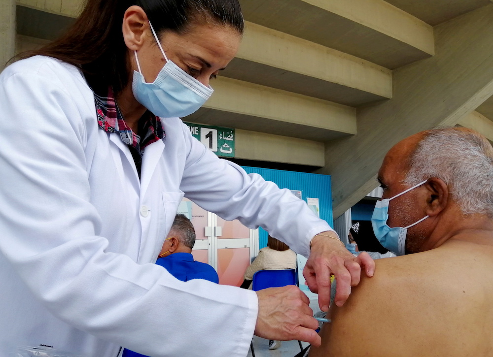 A man receives a Covid-19 vaccine at a vaccination centre in Tunis, Tunisia, April 26, 2021. Picture taken April 26, 2021. u00e2u20acu201d Reuters picnn