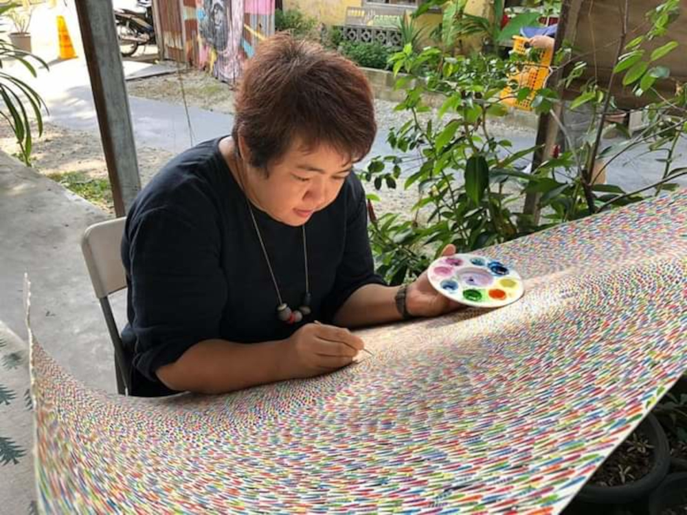 Queen Lee working on her watercolour painting. u00e2u20acu201d Picture courtesy of Queen Lee 