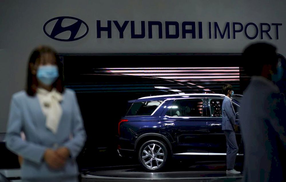 Staff members wearing face masks are seen at a Hyundai booth at the Beijing International Automotive Exhibition, or Auto China show, in Beijing, China September 27, 2020. u00e2u20acu201d Reuters pic