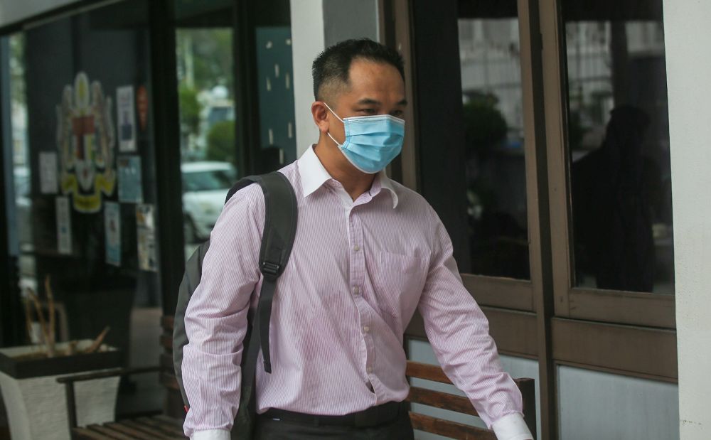 Rantau Urusan (M) Sdn Bhd director Lee Wei Jin, 38, arrives at the Ipoh Sessions Court on July 29, 2021. u00e2u20acu201d Picture by Farhan Najib