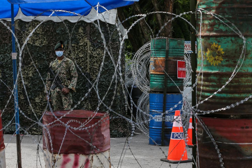 An Armed Forces personnel is seen at the Taman Bukit Angkasa PPR amid the enhanced movement control order in Kuala Lumpur July 11, 2021. u00e2u20acu201d Picture by Yusof Mat Isa