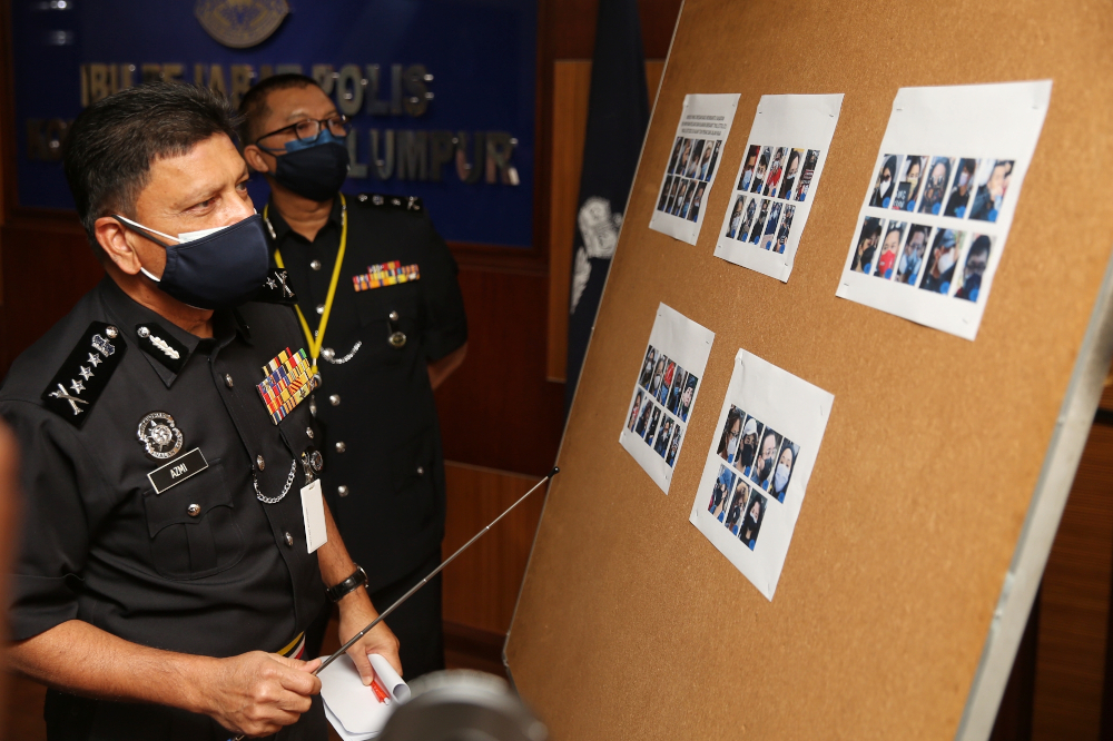 Kuala Lumpur police chief Comm Datuk Azmi Abu Kassim showing pictures of participants of the #KeluarDanLawan demo at the Kuala Lumpur Contingent Police Headquarters, August 2, 2021. u00e2u20acu2022 Picture by Choo Choy May