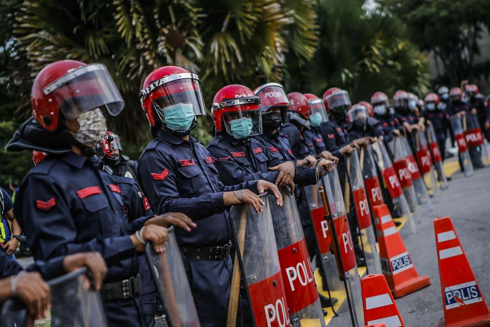 Federal Reserve Unit personnel are seen blocking access to the Parliament building in Kuala Lumpur August 2, 2021. — Picture by Hari Anggara