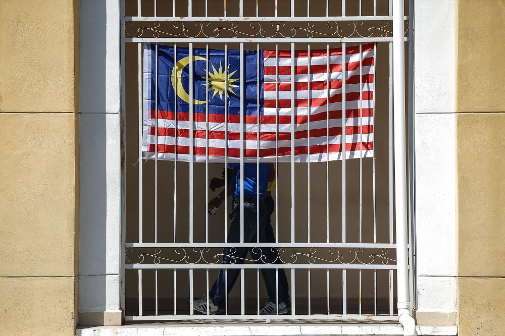 The Jalur Gemilang is seen at a building in George Town August 6, 2021. u00e2u20acu2022 Picture by Sayuti Zainudinn