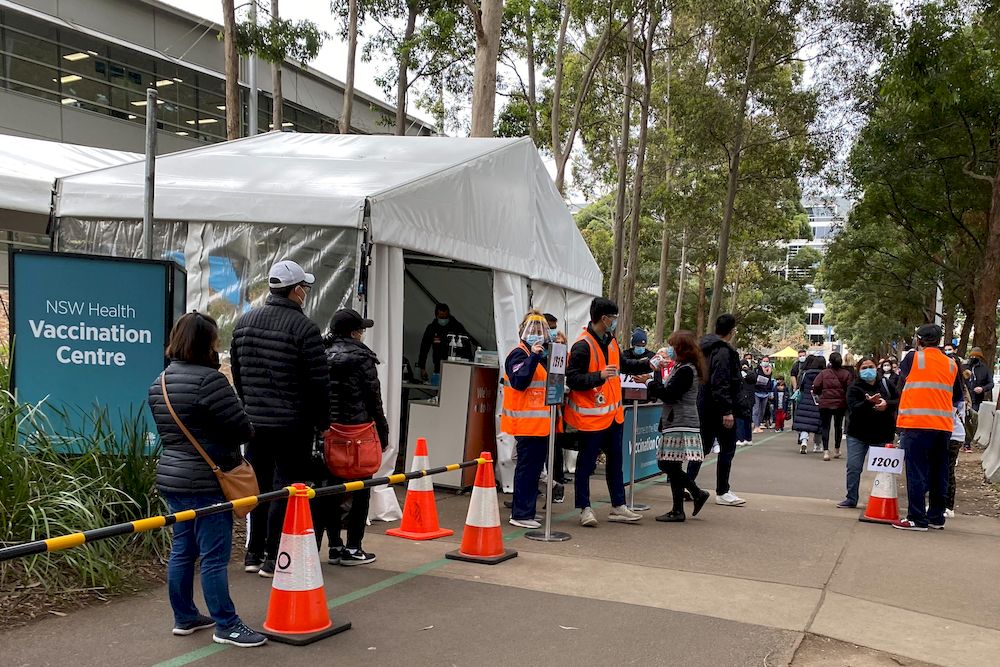 People wait in line outside a coronavirus disease (Covid-19) vaccination centre at Sydney Olympic Park in Sydney, Australia, July 14, 2021. u00e2u20acu201d Reuters pic
