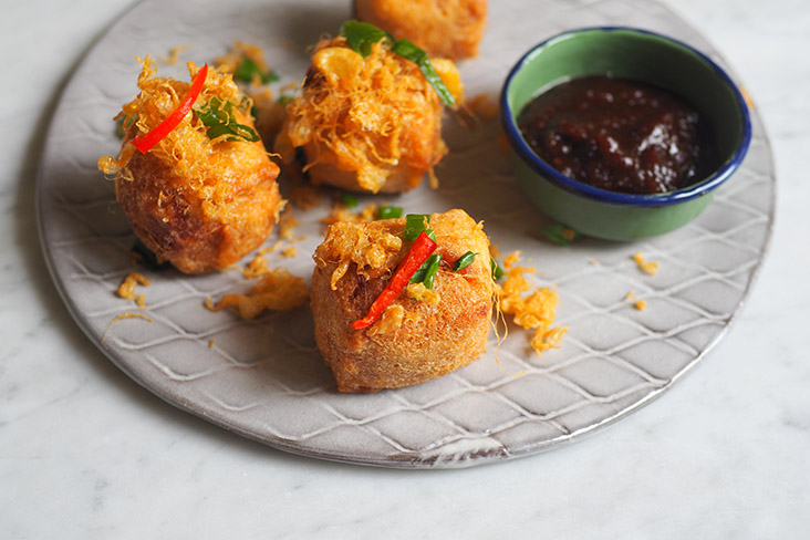 Nibble on these golden fried 'tauhu sumbat begedil' paired with a flavourful 'sambal kicap' sauce