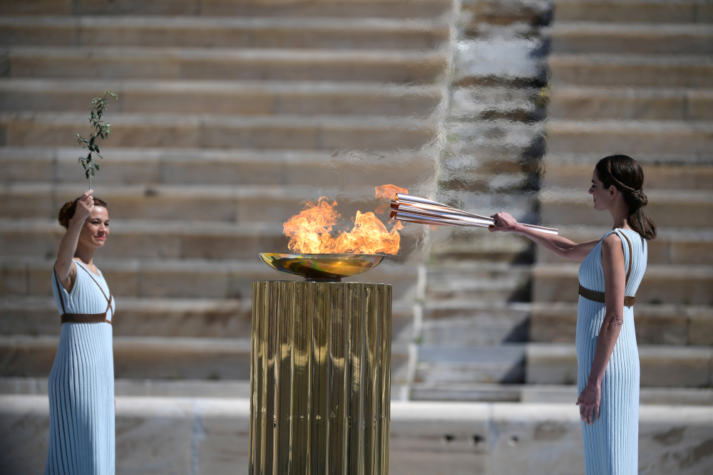 Greek actress Xanthi Georgiou lights the Olympic torch during the Olympic flame handover ceremony for the 2020 Tokyo Summer Olympics, in Athens, March 19, 2020. u00e2u20acu201d Reuters pi 