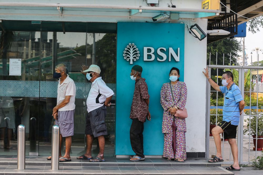 People queue in front of a Bank Simpanan Nasional branch in Klang September 6, 2021. — Picture by Yusof Mat Isa