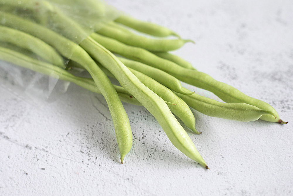 Blanch the French beans to retain a nice snap.