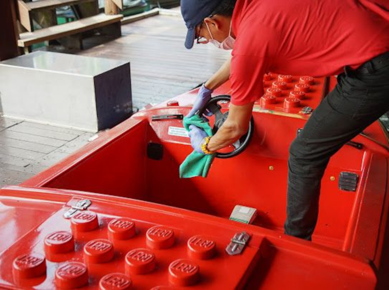A worker at Legoland Malaysia gets ready for the theme park’s reopening.