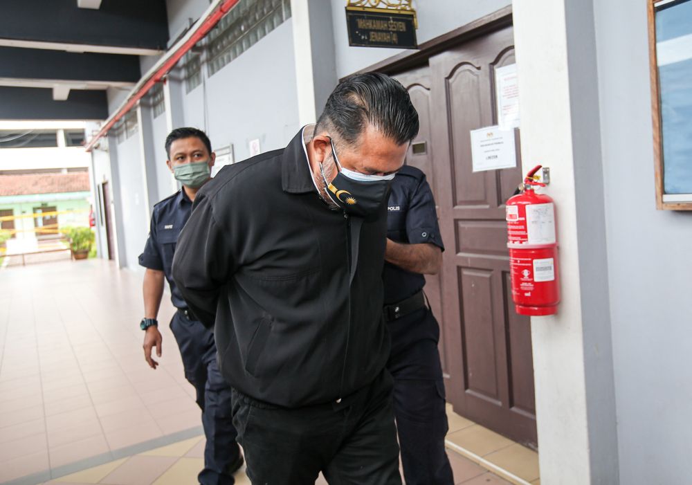 Mohamad Halmi Warajemini is pictured at the Ipoh Sessions Court October 21, 2021. u00e2u20acu201d Picture by Farhan Najib