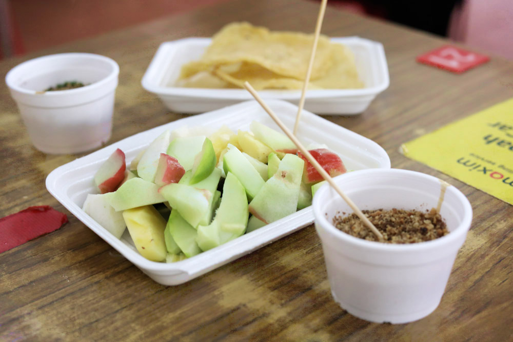 At Loke Wooi Kee, the 'rojak buah''s' sauce is served separately from the fruit and prawn crackers.